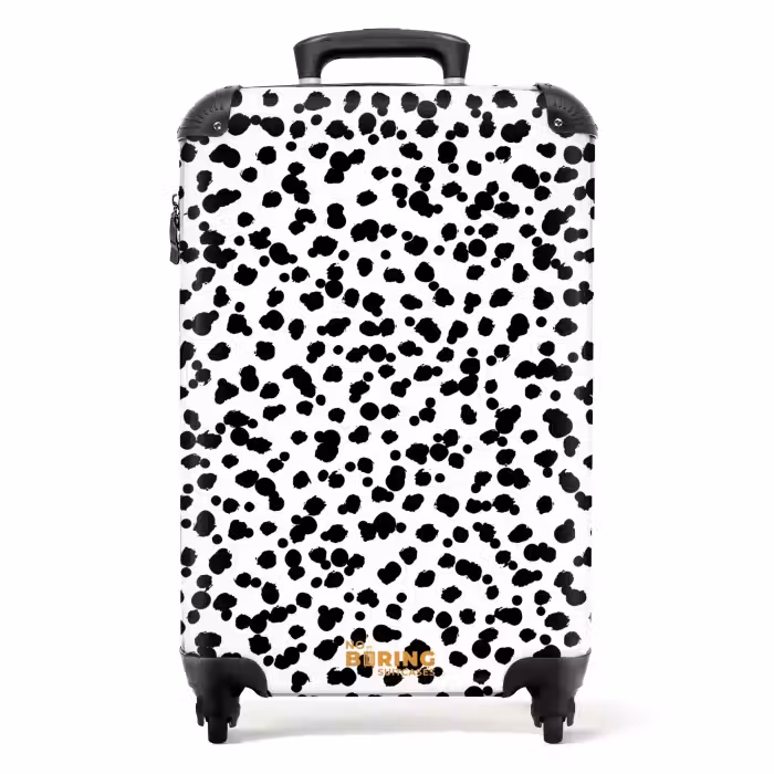 Suitcase - Black brush-like dots on a white background.