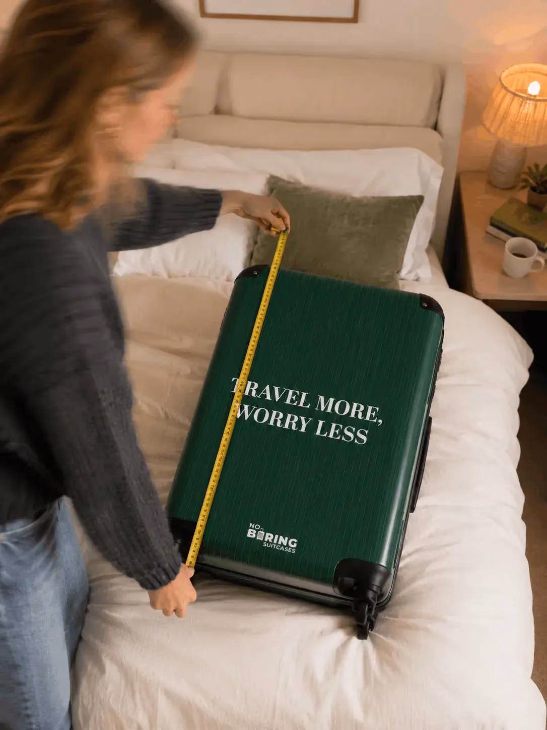 girl measuring suitcase