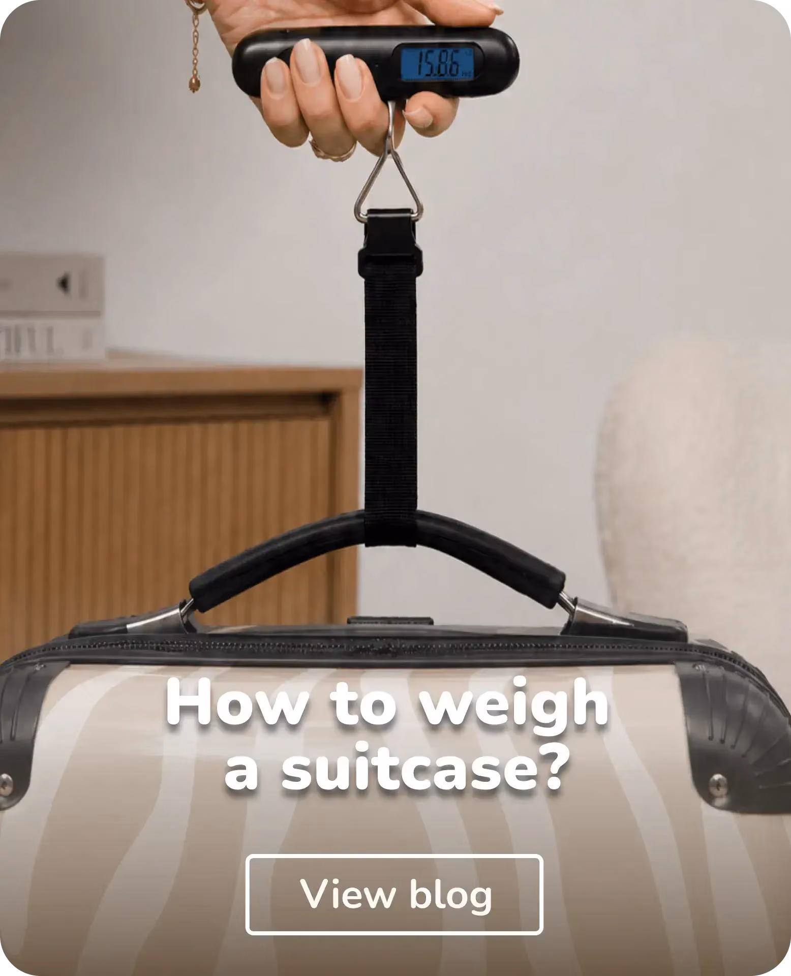 person weighing their suitcase